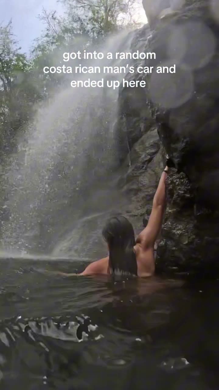 Makenna cliff jumping into a waterfall in Montezuma, Costa Rica